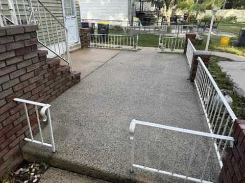 Concrete walkway after cleaning, with a lighter surface