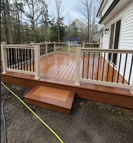 Wood deck after cleaning, with lighter boards