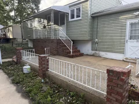 Front walkway and steps after cleaning, with lighter concrete